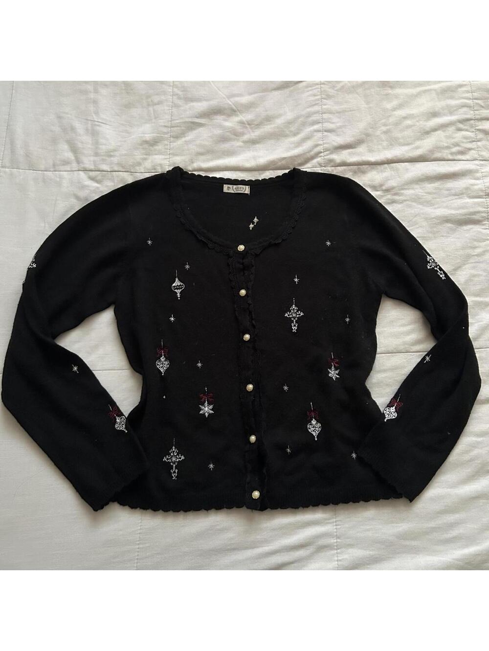 Axes Femme black cardigan featuring embroidered cross and ornament motifs